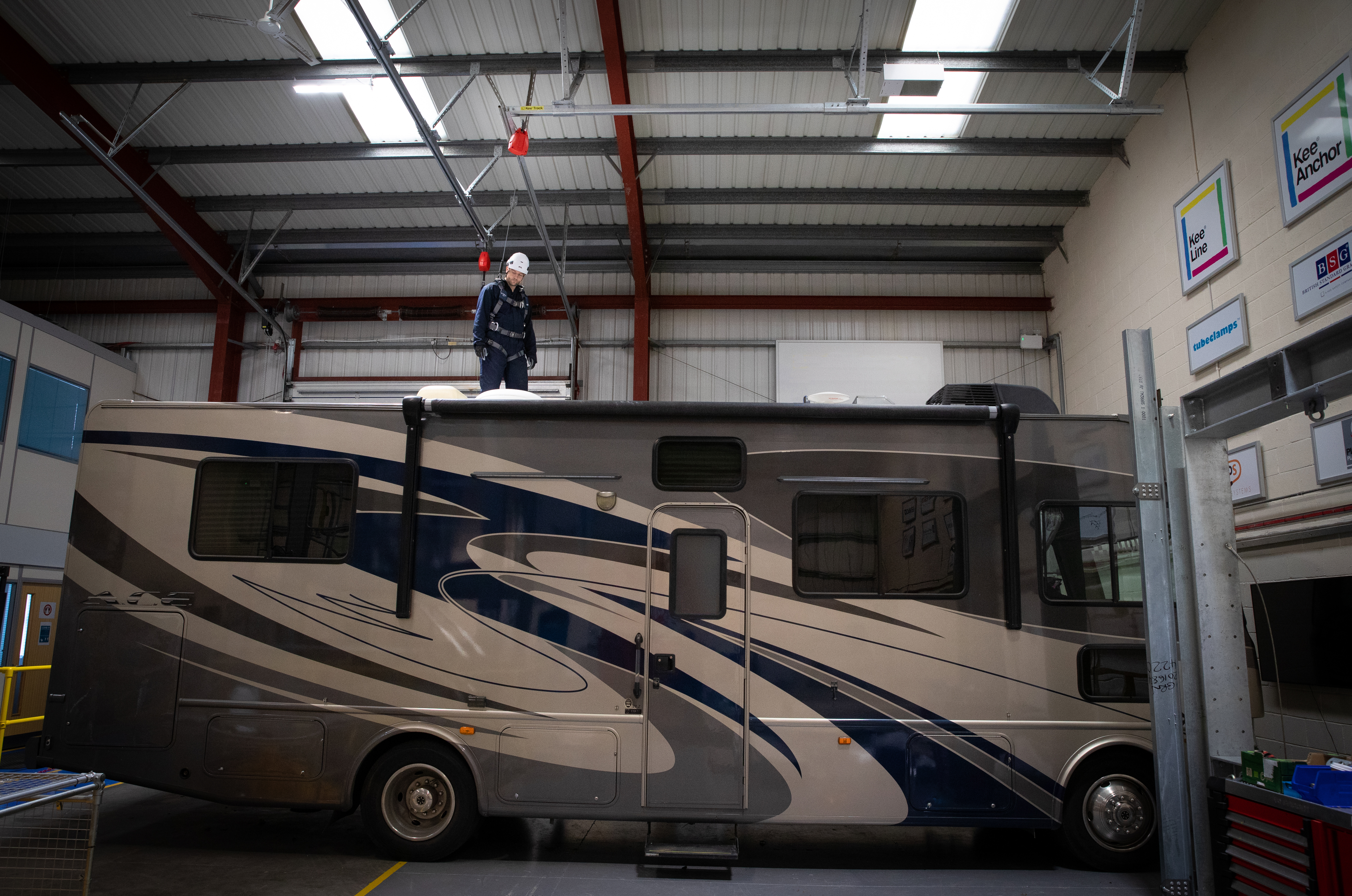 rigid track fall arrest system